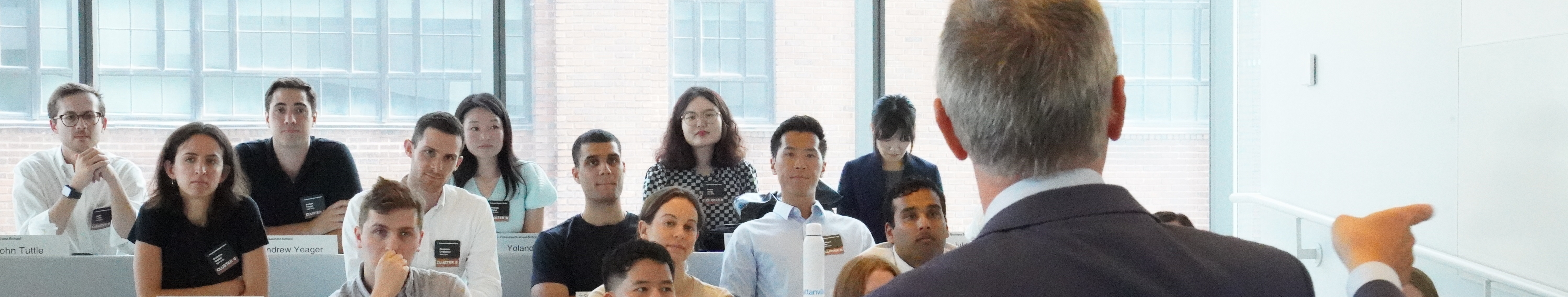 Students listen to a professor lecture in the classroom