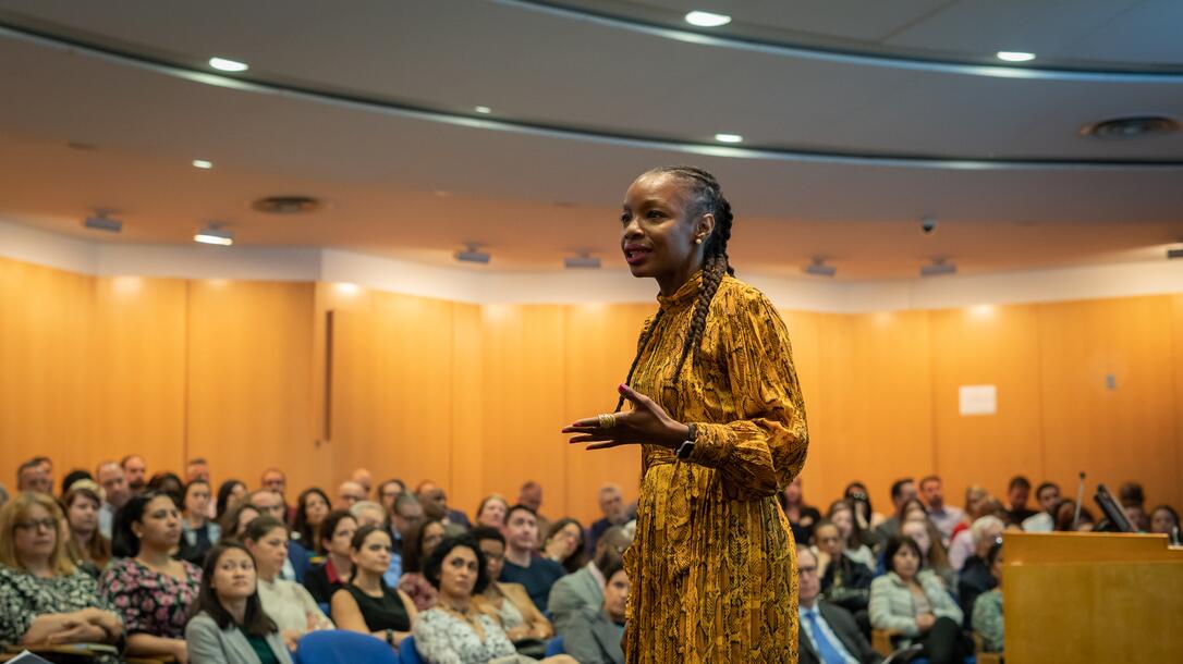 Modupe Akinola delivers a lecture to a crowded hall