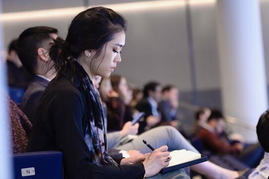 Student taking notes